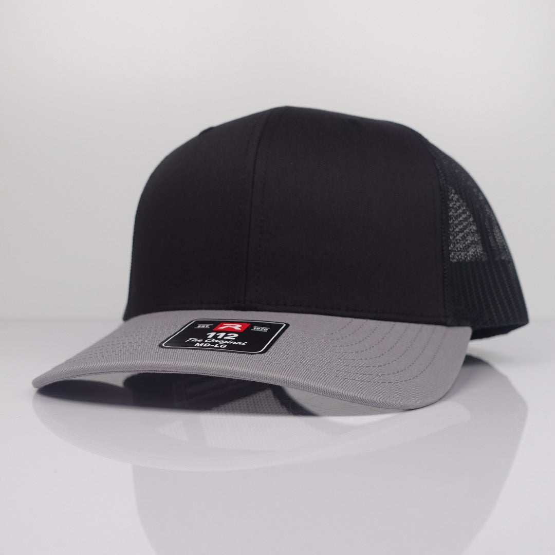 Custom Embroidered Trucker Hat - Richardson 112 option shown in Black / Light Grey CMB