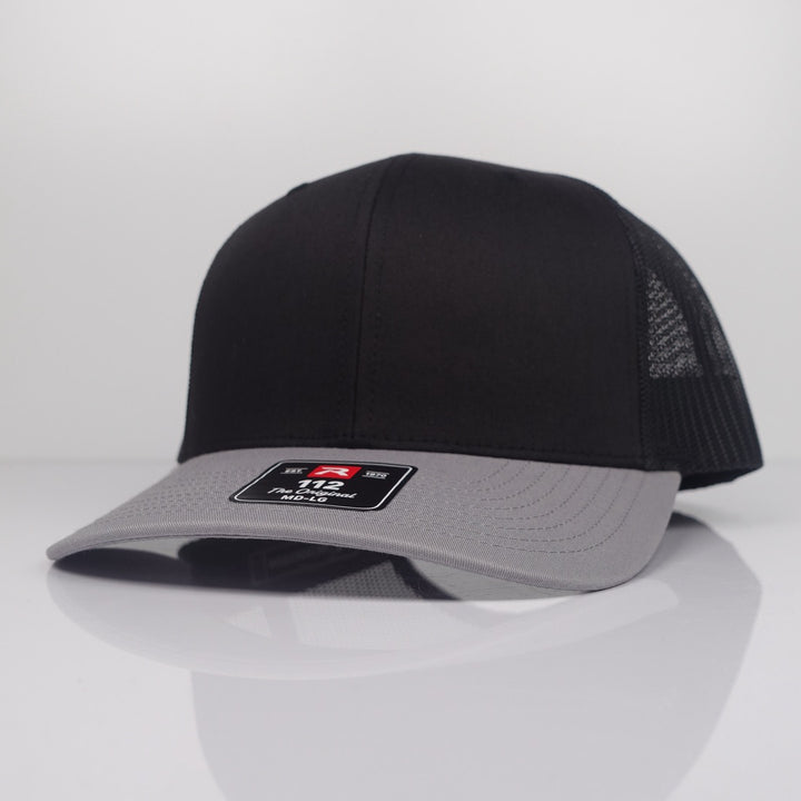Custom Embroidered Trucker Hat - Richardson 112 option shown in Black / Light Grey CMB