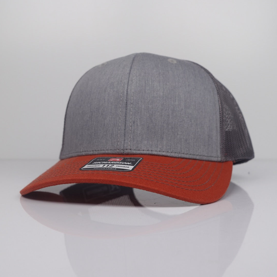 Custom Embroidered Trucker Hat - Richardson 112 option shown in Heather Grey / Charcoal / Dark Orange