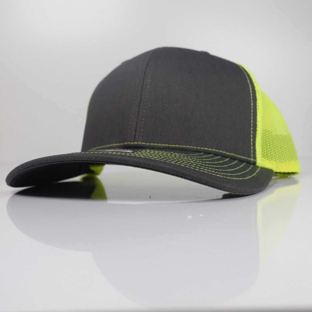 Charcoal / Neon Yellow Richardson 112-style custom trucker hat blank side view